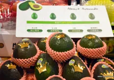Avocado's popularity is growing in China. In the back an info sheet informing about ripeness, colour and taste. These avocadoes are imported from Mexico.