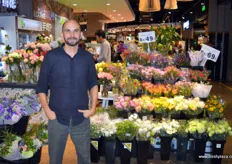 Felipe Villamizar of Maria Flowers is happy to see fresh flowers at the entrance of the shop.