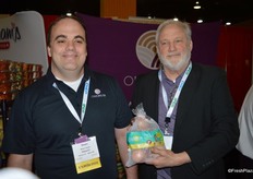 Shawn Hartley and Robert Alven of Onions 52 showing Sunions - tearless sweet onions.