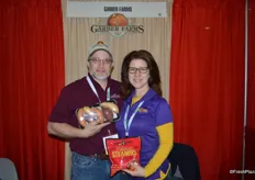 Matt Garber and Sherrill Garber proudly show a mix- color tray of sweet potatoes as well as a bag of steamers.