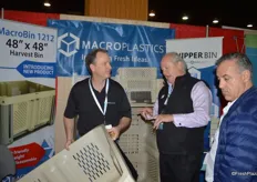 Mark Malatras with Macro Plastics shows a bin to show attendees.