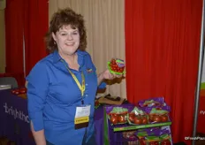 Kathryn Ault with NatureSweet proudly showing organic grape tomatoes from the Brighthouse Organics line.
