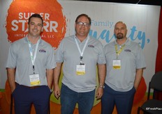 Chris Hoffman, Lance Peterson and Mert Gumus with Super Starr International. They had papaya on display for show attendees to taste.