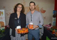 Lyra Vance and Carlos Flores with Village Farms. Lyra shows a 2 lb. True Rebel pack. Increasingly, grocery stores are promoting large volume packs, she said. Carlos shows the company’s Lorabella Blossom tomatoes.
