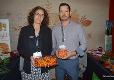 Lyra Vance and Carlos Flores with Village Farms. Lyra shows a 2 lb. True Rebel pack. Increasingly, grocery stores are promoting large volume packs, she said. Carlos shows the company’s Lorabella Blossom tomatoes.