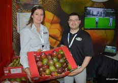 Tonya Hill and Jonathan Smith with Amazon Produce Network, proudly showing a larger box of mangos.