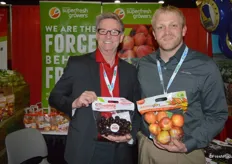 Dan Harrington with Domex Superfresh Growers shows Two Bite Cherries while Robert Dresker shows a pouch bag of Autumn Glory apples. Robert works with Domex’ transportation division, called DSG Logistics.