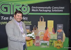 Justin Lenz with Giro Pack shows the company's latest product: the handle bag can be used for any produce variety.