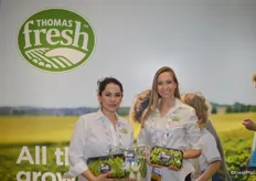Carolina Chevalier and Andrea Dubak with Thomas Fresh proudly show specialty produce items in the company's new compostable, recyclable trays.