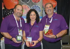 Vince Ferrante, Leslie Simmons and Mike Bowe with Dave's Specialty Imports show Florida blueberries, pomegranate arils as well as California-grown strawberies.