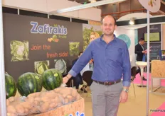 Naso Zafirakis, Director of Zafirakis Fruits, with their watermelons and potatoes on display for passers by.
