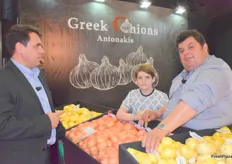 Deep in conversation, a quick pause for the camera at the Greek Onions Antonakis stand.