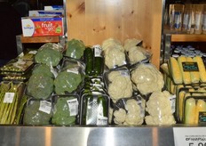 Sold on a tray and wrapped in plastic: asparagus, broccoli, squash, cauliflower and sweet corn.