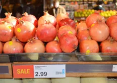 Pomegranates on sale for CAD 2.99 each.