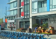 Bike share station in front of City Market. There are many stations throughout the city and the bikes can be unlocked from one station and returned to any station in the system.