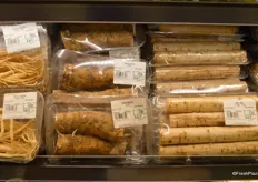 The store has an abundant selection of exotic produce items. This picture contains fresh ginseng, horseradish and long gobo.
