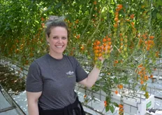 Leesa Garnett proudly shows Lorabella Blossom tomatoes.