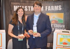 Annette and Joel Starling with Millstream Farms. Annette shows microwaveable sweet potatoes as well as the Red Murasaki variety. Joel shows the Covington sweet potato.
