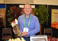 Mike Reed with California Endive Farms proudly shows organic white and red Belgian endive.