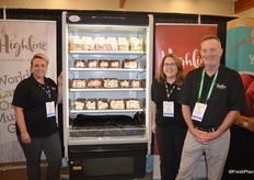 Sabrina Pokomandy, Jane Rhyno and Rick Watters with Highline Mushrooms show a cooler filled with organic mushroom products.