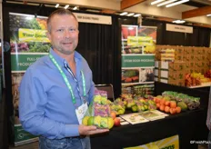 William Ison with Earth Source Trading / Four Seasons Produce shows an organic lemon/lime combo in mesh bag.