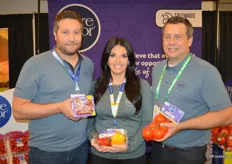 Jamie Moracci, Tiffany Sabelli and Chris Veillon with Pure Flavor show organic grape tomatoes, bell peppers and TOVs. All labels for the company's organic products are purple.
