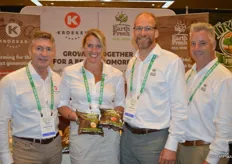 Wayne Rempel of Kroeker Farms, Stephanie Cutaia, Derrick Rayner and Dan Martin with EarthFresh. Stephanie shows yellow and red organic baby potatoes in light-blocking packaging to prevent the potatoes from greening. Kroeker Farms grows potatoes for EarthFresh in Manitoba.