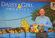 Daisy Girl, the organic brand of CMI Orchards. George Harter shows pouch bags with Daisy Girl Kiku and Ambrosia apples, as well as a bag of Daisy Girl cherries.