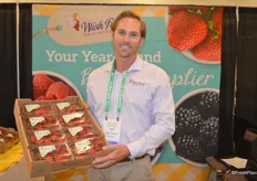 Jason Deis with Wish Farms shows a flat of organic strawberries.