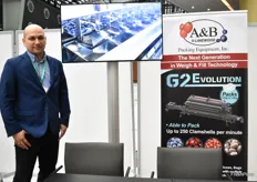 Piotr Milewski from A&B Packaging promoting a blueberry packing machine.
