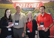 Jim Grabowski with Well Pict is flanked by Lauren Melenbacker, Johnna Johnson and Anthony Donilla of Marketing Plus. Lauren and Anthony proudly show strawberries and raspberries.