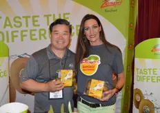 John Kang and Melanie Stavinski with Zespri are excited for the New Zealand kiwifruit season. They are proudly showing Sun Gold kiwis.