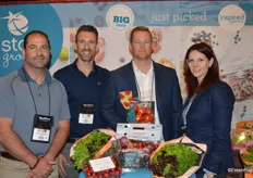 The Star Group is represented by Jason Domenico, Gord Morrison, Dustin Emberley and Rindi Bristol. The table in front shows some of Star's products, including Inspired Greens, blueberries and cherries.