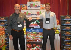 Tim Colln and Ryan Easter with Sage Fruit next to the company's new cherry display.