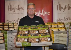 John Sheehan with Highline Mushrooms shows organic Mini Bella mushrooms in top seal packaging.