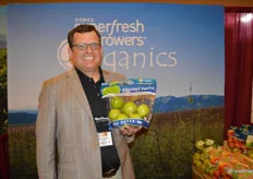 Mike Preacher with Domex Superfresh Growers shows a 3 lb. pouch bag of Granny Smith apples.