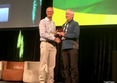 Tony Pattison being presented with an award by Nick MacLeod.