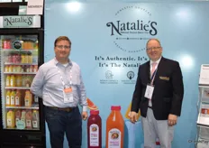 Michael Ward and Michael D’Amato with Natalie’s Orchid Island Juice Company offer juice samples to show attendees.