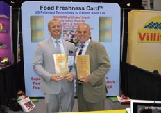 RJ Hassler and his dad Rick Hassler proudly show a larger size Food Freshness Card for retail. A smaller version can easily be put in the refrigerator at home and prevents mold development. For the third year in a row, the company won the Innovation Award for Best Food Safety Solution.