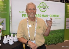 Kevin Payne with Zest Labs smiles for the photo with Zesty the polar bear.