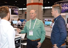 Robert Verloop with Coastline Family Farms stops by the Aerobotics booth to learn more about the company.