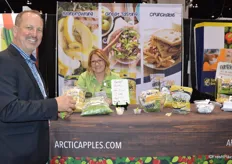 Greg Corrigan from Raley's and Chairman of the Board of United Fresh tries Arctic ApBitz from Okanagan Specialty Fruits and learns more about the product from Jessica Brady.