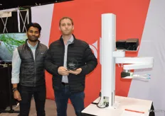 Akash Nandi and Josh Lessing with Root AI proudly show the award and the tomato-harvesting robot.