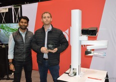 Akash Nandi and Josh Lessing with Root AI proudly show the award and the tomato-harvesting robot.