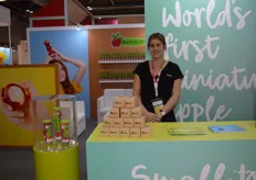 Annabel Hall at the Rockit stand with small cardboard gift packs with one Rockit apple to give to visitors.