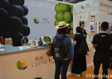 Team of Lurra (Shenzhen) Trading Co., Ltd. busy presenting their products to visitors. They mainly trade grapes, persimmon, strawberry and loquat.