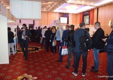 Visitors standing in line to plan their speed-dates with retailers.