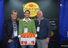 Jon Esformes, Lyle Bagley and Carlos Blanco with Sunripe Certified Brands. Lyle proudly shows a box of Italian style Roma tomatoes.