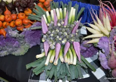 Beautiful display of purple Brussels sprouts, purple radish and baby leeks at the Babe Farms booth.