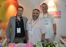 Luis Orrantia with Tropical Specialists on the left is visiting the booth of Freska Produce International. Jesus "Chuy" Loza and Jose Juan Rodriguez are on the right. 